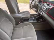 A picture of Sharp 2004 toyota camry 2 4 with 4plugs engine grey