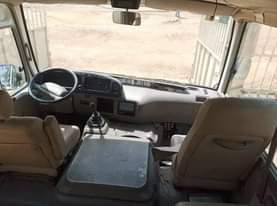 A picture of Tokunbo white Toyota coaster bus for sale... diesel engine...2016 model