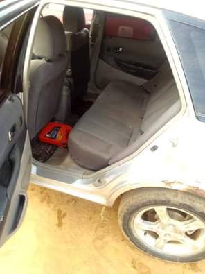 A picture of Mazda 323 for sale direct Belgium 3months used everything is