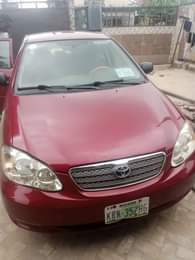 A picture of Toyota Corolla red with silent engine sharp gear and chilling