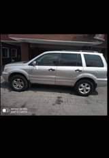 A picture of Another clean in and out Honda pilot 2004 model with