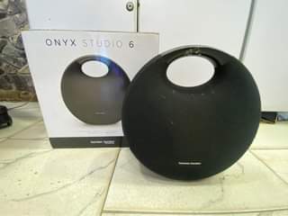 A picture of Harman Kardon onyx studio 6 Bluetooth rechargeable speaker slightly used