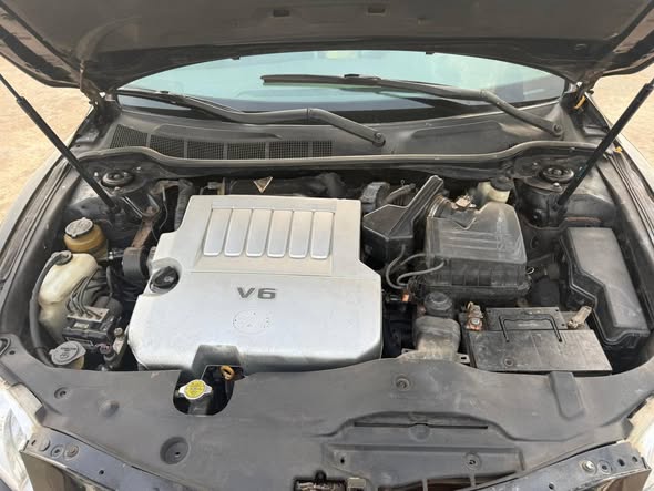 A picture of 2008 Toyota Camry XLE V6 excellent condition Untampered engine gear