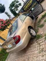 A picture of Toyota camry 2005 big daddy painted on on first body