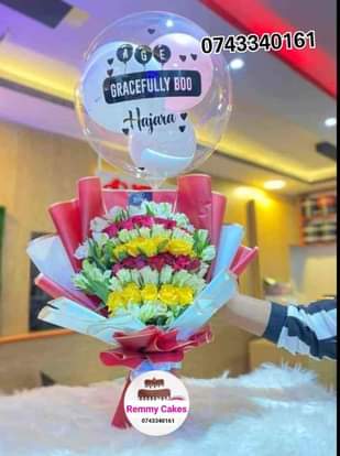 A picture of  flowerbouquet moneyhampers balloons cakes surprisepackages gifts deliveryavailable kampalaUg
