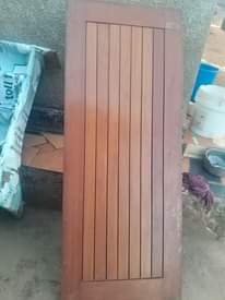 A picture of 6 mahogany doors and 1 Aluminium door