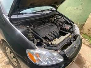 A picture of 2005 Corolla few months used neatly painted Abuja airport road