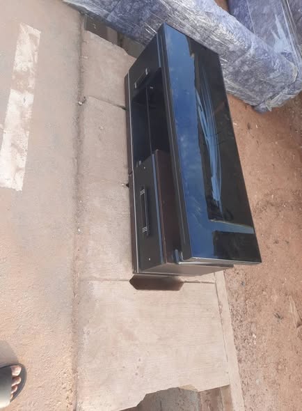 A picture of very clean and Neatly use foreign tv stand for sale