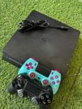 A picture of Ps4 slim 2 controller with games