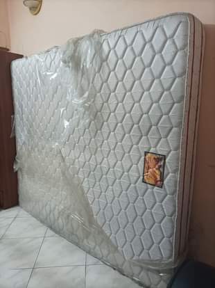 A picture of Mattress and dinner table set