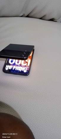 A picture of Samsung Z flip 4 Storage 256 call WhatsApp 0755148172