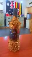 A picture of wall mirror decor lampshades and bottles