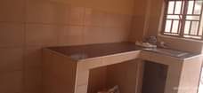 A picture of House for sale nansana kyebando 3bedrooms sitting dining kitchen apple