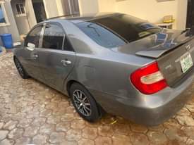 A picture of Delay is dangerous 2004 Toyota Camry big daddy Painted on