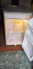 A picture of Dinning table with adh fridge both for sell at 800k