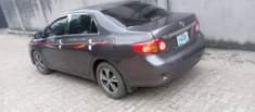 A picture of Toyota Corolla model 2010 engine gear box AC chilling clean