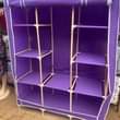 A picture of 3 column wooden closets