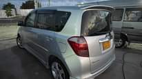 A picture of WhatsApp call 255 762 483 424 Toyota ractis Colour sliver