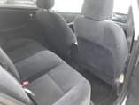 A picture of Toyota camry 2007 with a unique green light