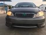 A picture of Toyota camry 2007 with a unique green light