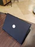 A picture of Dell laptop with strong battery at 230k