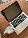 A picture of MacBook Pro. Core i7. Ram 8gb
