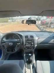 A picture of SUPER SHARP DIRECT 2002 MAZDA 323F with fully paid duty