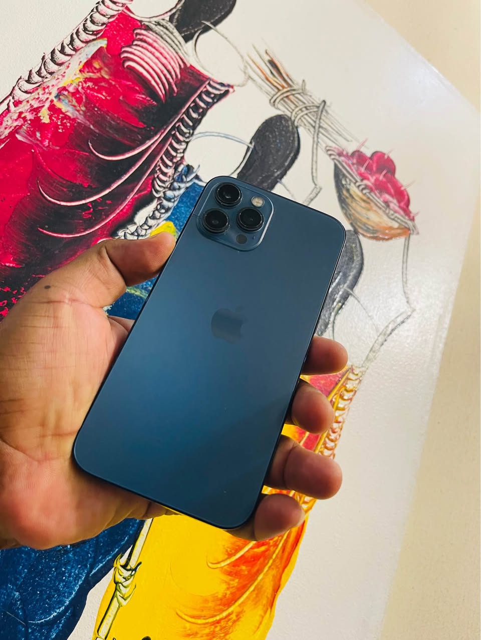 A picture of Iphone 12 pro max available Gb 128 Used clean BH