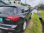 A picture of 2010 Acura MDX in good working condition and untampered components