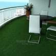 A picture of Artficial turf grass for offices.balconies.compoundz .etc