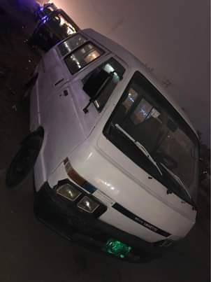 A picture of A White vannet Bus With Diesel engine