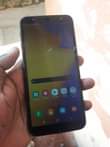 A picture of Samsung galaxy J6 small crack side fingerprint