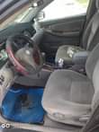 A picture of 2004 Corolla partly painted Urgent sale Everything working ok 1