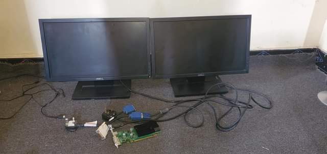 A picture of 2 Dell computer screen inch 20