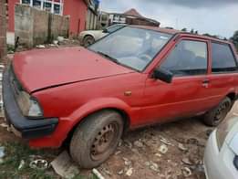 A picture of Toyota starlet two doors with smoking engine location Ibadan price